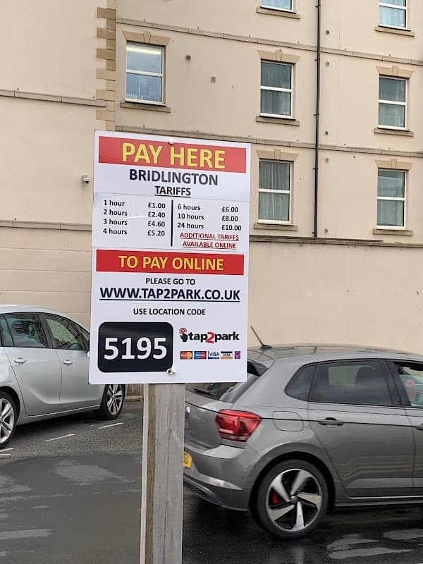 Pay & Display sign with parking tariffs and online payment instructions at York Road Car Park, Bridlington.