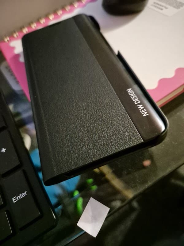 Pod Point Charging Station sign with charging unit, set against a backdrop of Brotherton, Yorkshire.