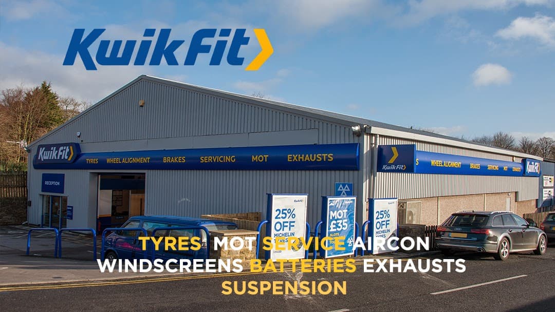 Kwik Fit shop exterior in Carleton-in-Craven, featuring services like tyres, MOT, and exhausts with promotional signage.