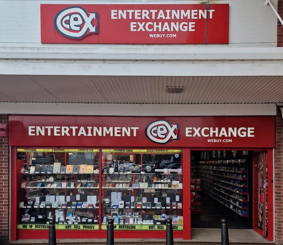 CeX store front featuring a bright red sign, displaying "Entertainment Exchange" and various electronic items in the window.