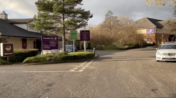 Pay & Display parking area with signage for Premier Inn and YourParkingSpace in Cleckheaton, Yorkshire.