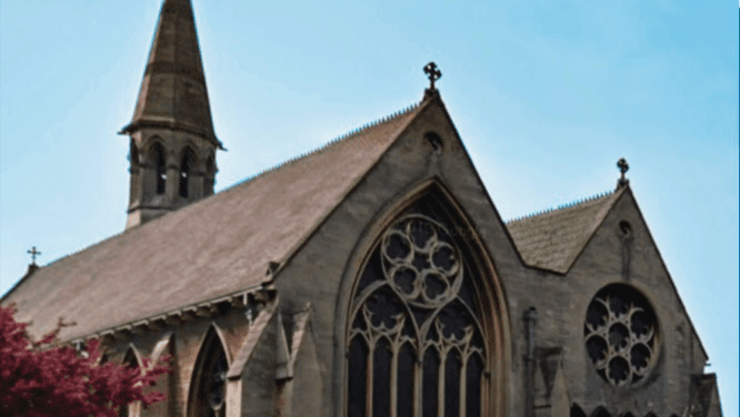 St James' Car Park in Doncaster, featuring a historic church with intricate stonework and a tall spire.