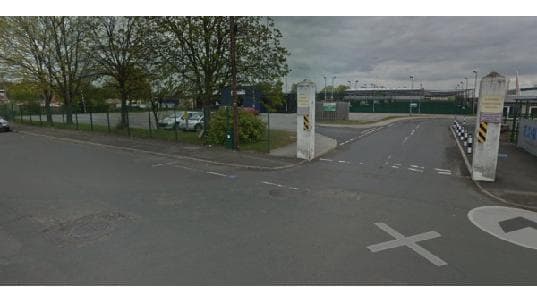 Pay & Display parking area in Doncaster, Yorkshire, with trees, a road, and a view of nearby facilities.