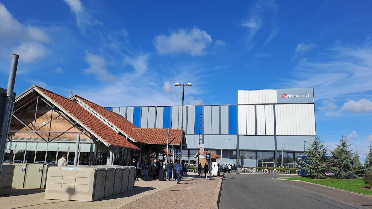 Monks Cross Park and Ride with Cineworld, featuring a modern building, clear blue sky, and people waiting outside.