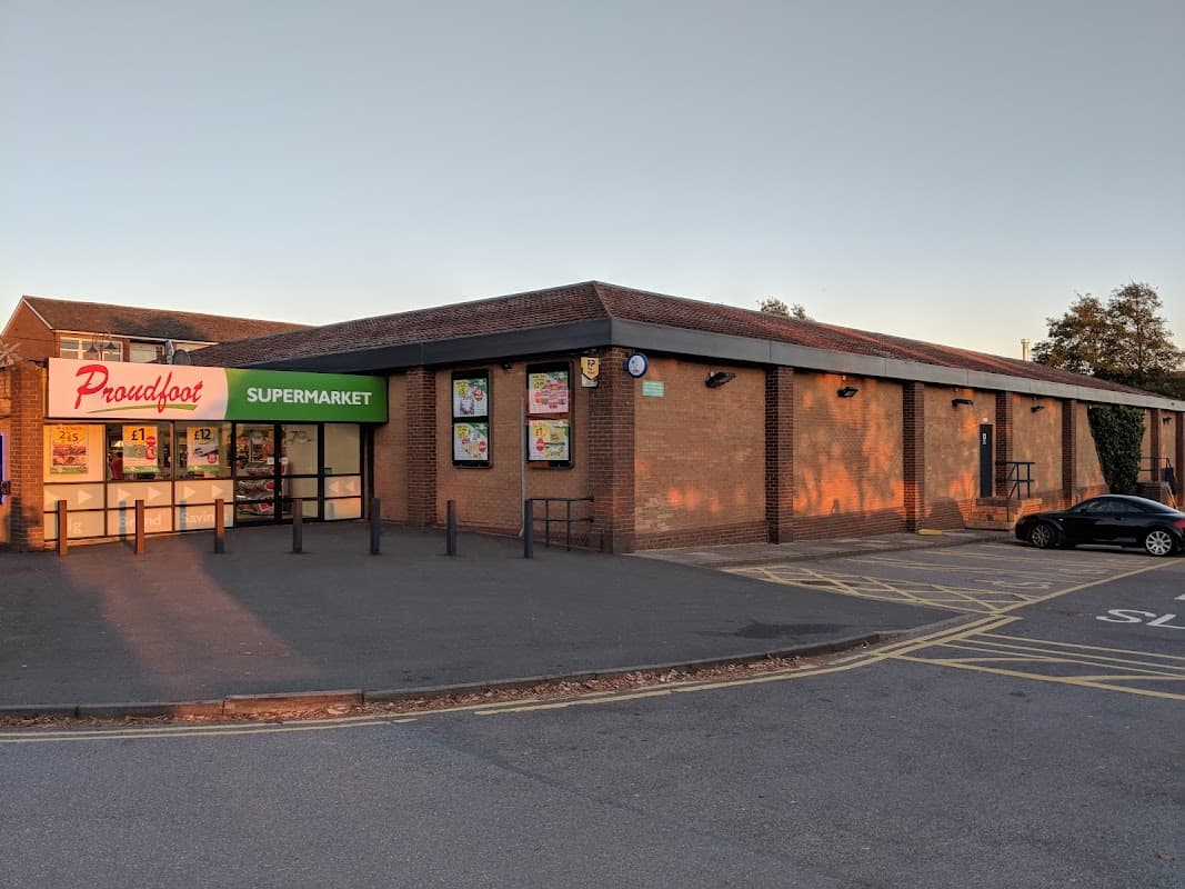 Proudfoot supermarket in Eastfield, North Yorkshire, with a brick exterior, large glass entrance, and parking area.