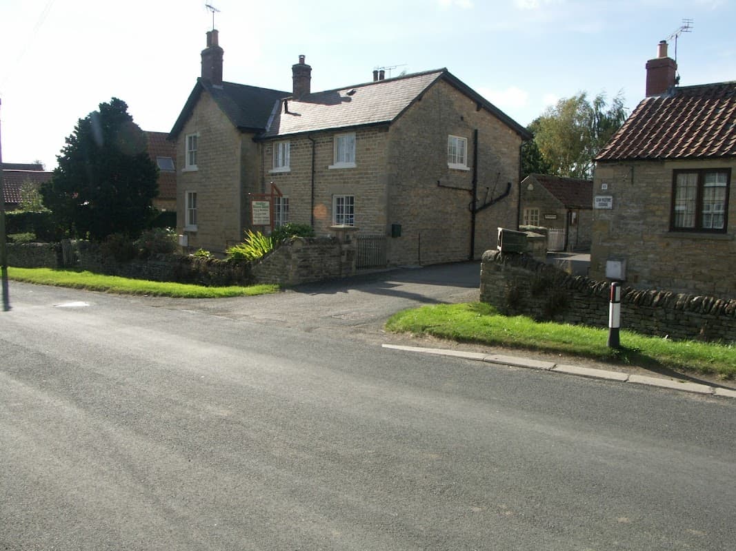 Charming stone house with a garden, located at a rural intersection in Ebberston, Yorkshire.