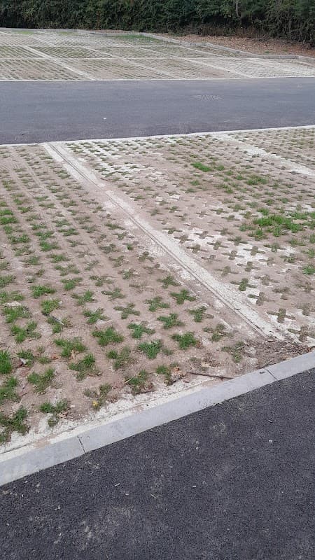 Free parking area at Bluebell Café in Eckington, Yorkshire, featuring grassed grid paving and empty spaces.