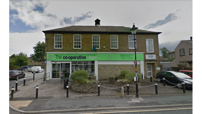 Co-operative Food store in Gargrave, Yorkshire, with a Pay & Display parking area and lampposts in view.