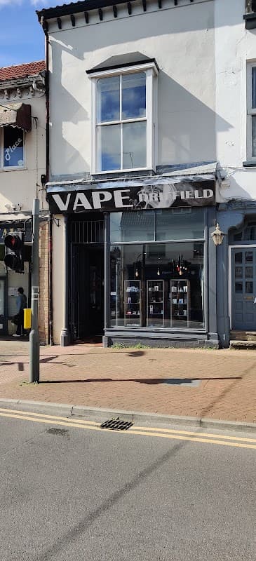 Vape Driffield storefront featuring large signage, display window with vape products, and a clear blue sky above.