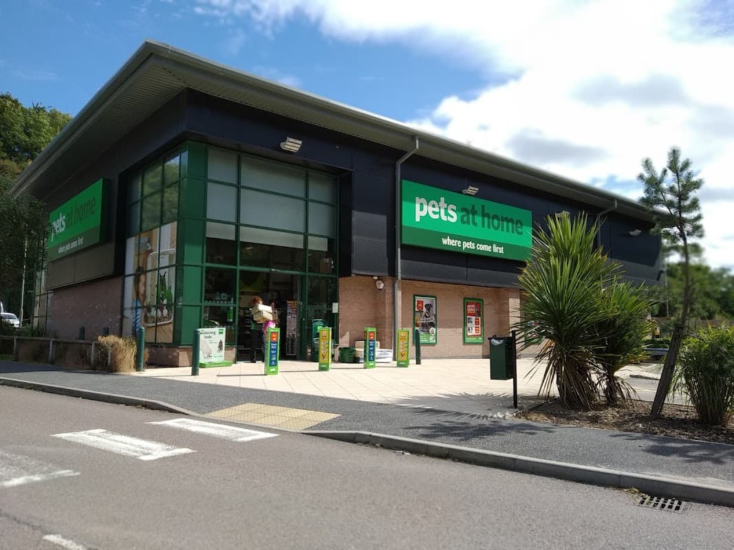 Pets at Home store exterior with green signage, large windows, and a landscaped entrance in Dronfield, Yorkshire.