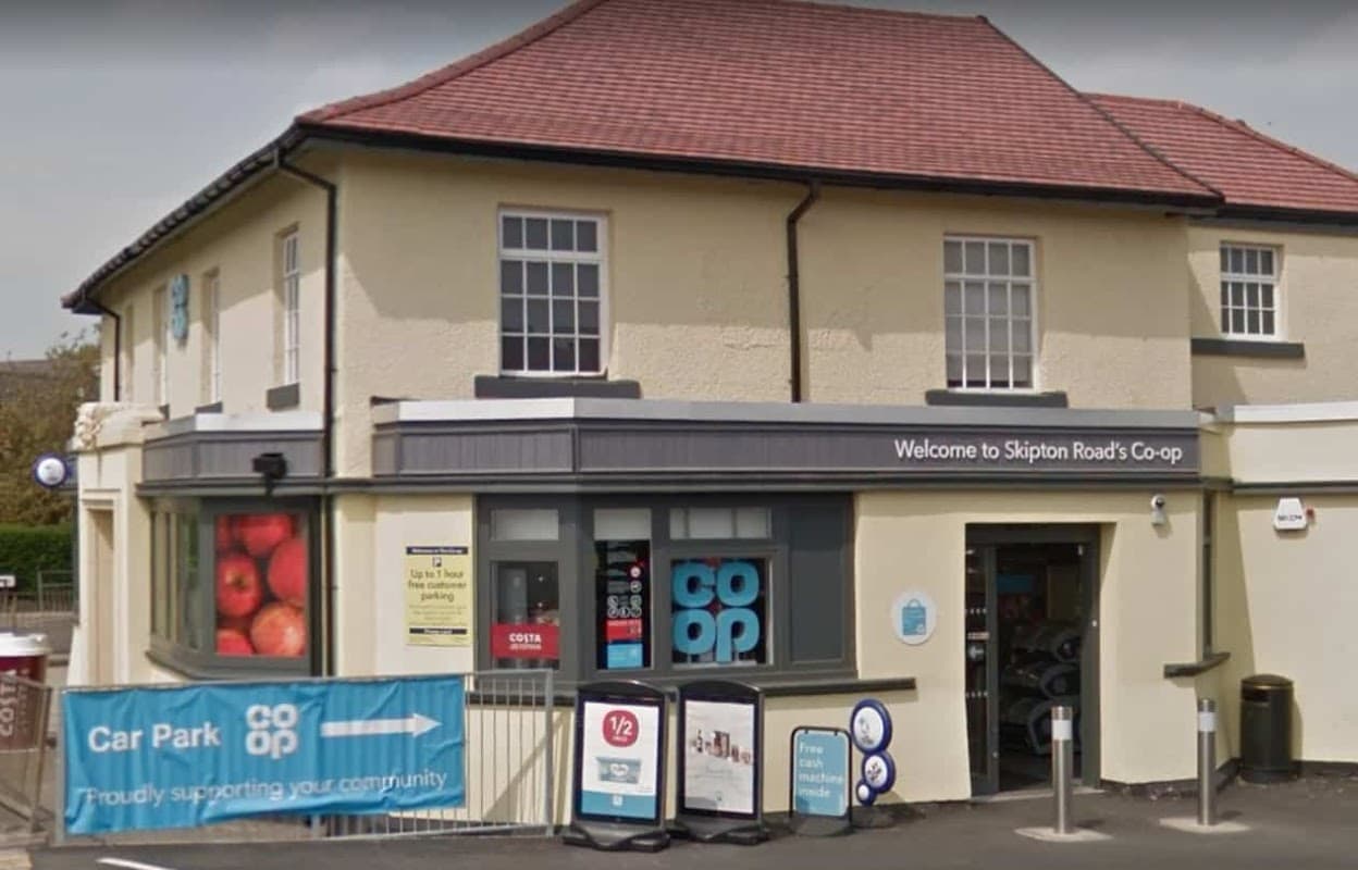 Co-op Food store on Skipton Road, featuring a welcoming entrance and signage, with a car park nearby.