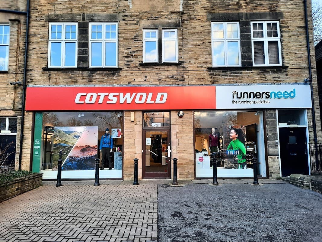 Cotswold Outdoor store front in Harrogate, featuring outdoor clothing displays and a sign for Runners Need.