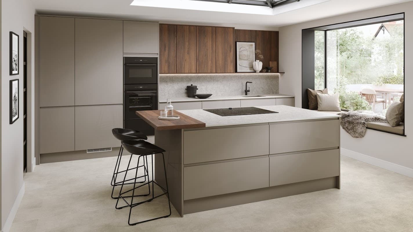 Modern kitchen featuring a central island with bar stools, sleek cabinetry, and large windows with outdoor views.