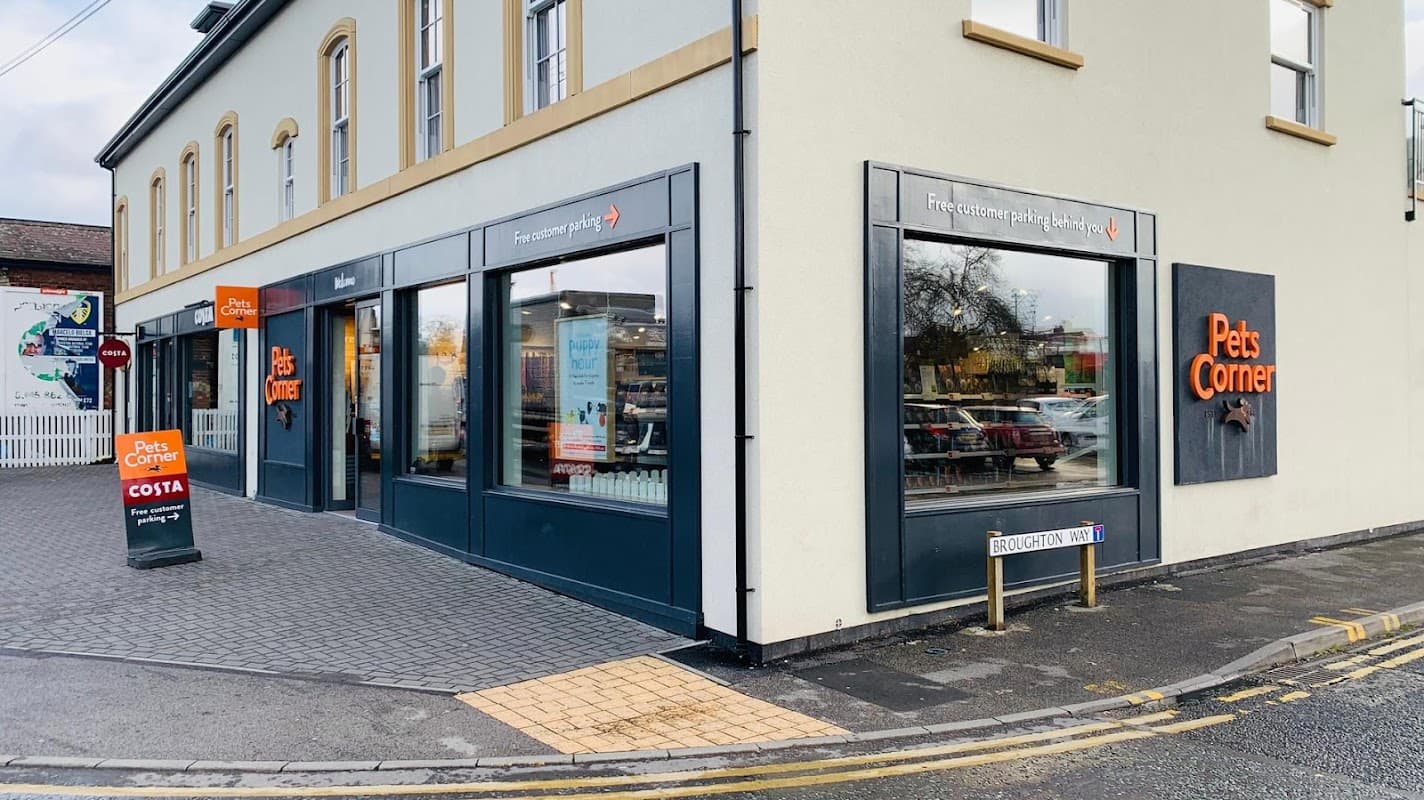 Exterior of Pets Corner pet shop in Harrogate, featuring large windows and a modern facade with signage.