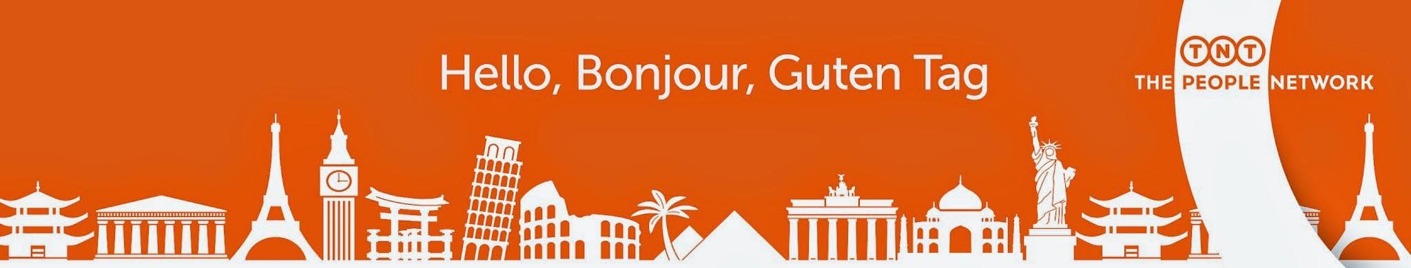 TNT Rotherham Depot signage with iconic landmarks silhouette and greeting in multiple languages on an orange background.