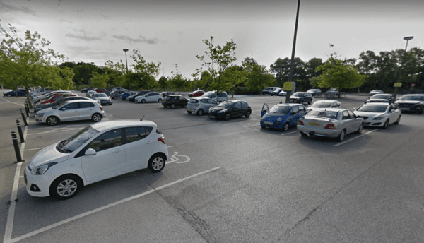 Pay & Display parking area in Hessle, Yorkshire, featuring various parked cars and trees in the background.
