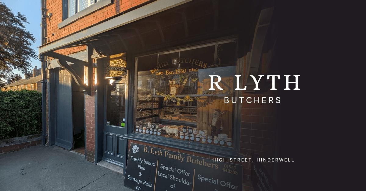 Shopfront of R Lyth Butchers in Hinderwell, featuring a display of meats and local produce.