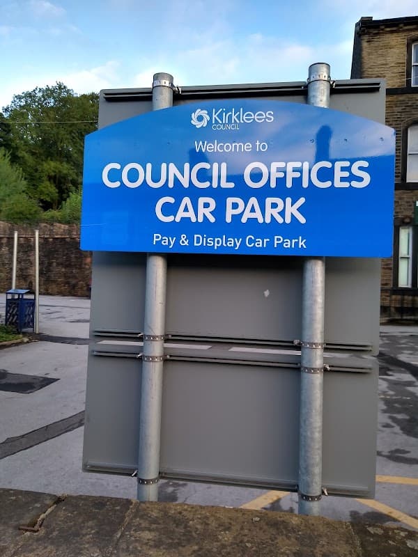 Welcome sign for Council Offices Car Park, featuring "Pay & Display" and Kirklees Council branding in Holme Valley, Yorkshire.