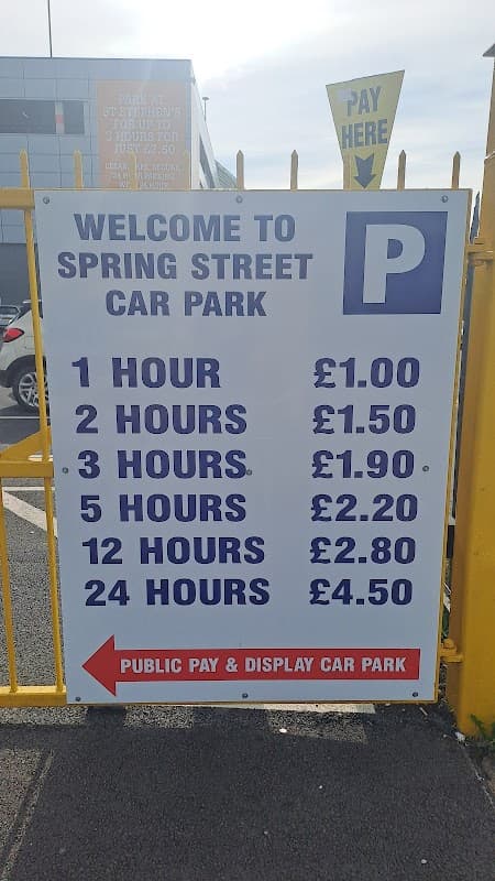 Sign at Spring Street Car Park displaying parking rates for various durations in Hull, Yorkshire.