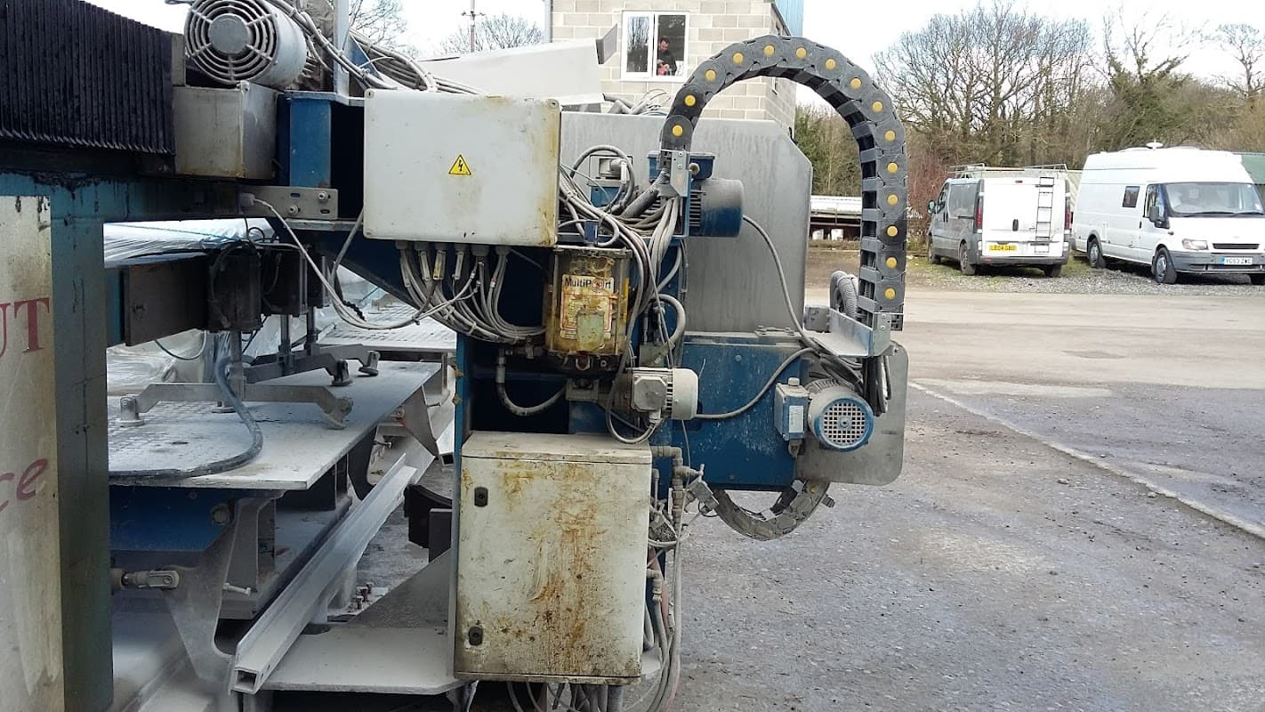 Industrial machinery with wires and control panels, set in a car parts business park in Killinghall, Yorkshire.