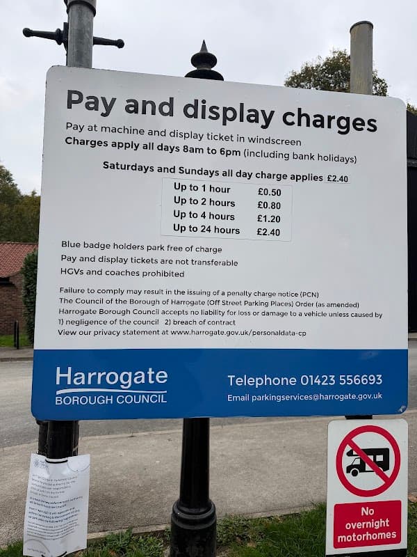 Sign detailing pay and display charges for parking at Waterside, Knaresborough, including fines and contact information.
