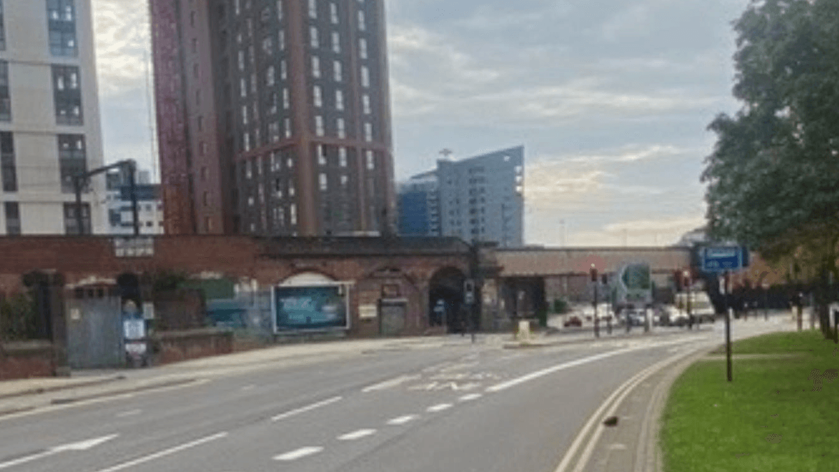 Pay & Display parking area near tall buildings and a road with traffic lights in Knowsthorpe, Yorkshire.