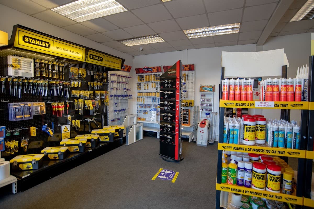 Brightly lit store interior showcasing tools and supplies, featuring Stanley products and various cleaning solutions.