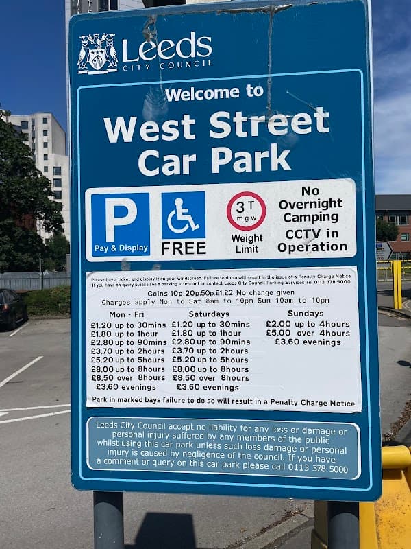 Welcome sign for West Street Car Park in Leeds, detailing parking charges and regulations. CCTV in operation.