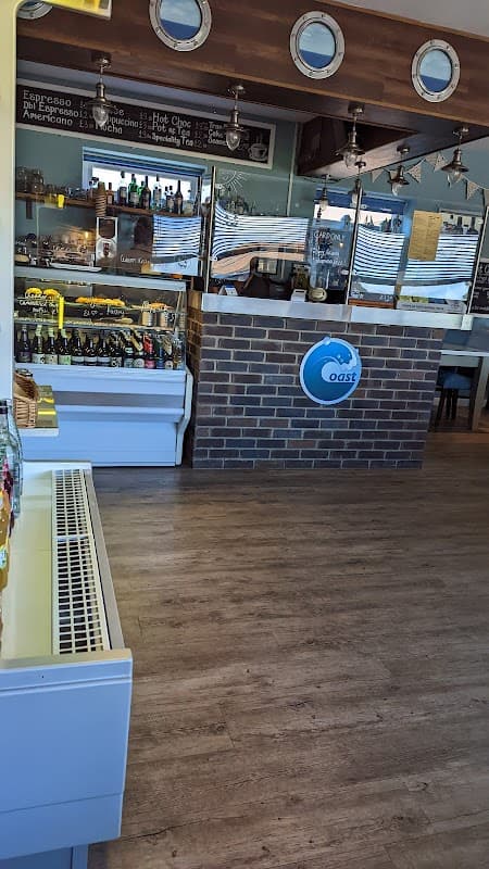 Modern bar interior featuring a brick counter, shelves of drinks, and a cozy atmosphere in Low Hawsker, Yorkshire.