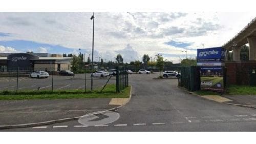 Pay & Display parking area in Middlesbrough, with multiple vehicles and a sign for "YourParkingSpace."