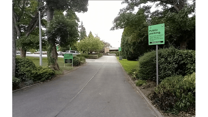 Pay & Display parking area in North Ferriby, Yorkshire, with green signage and a tree-lined entrance.