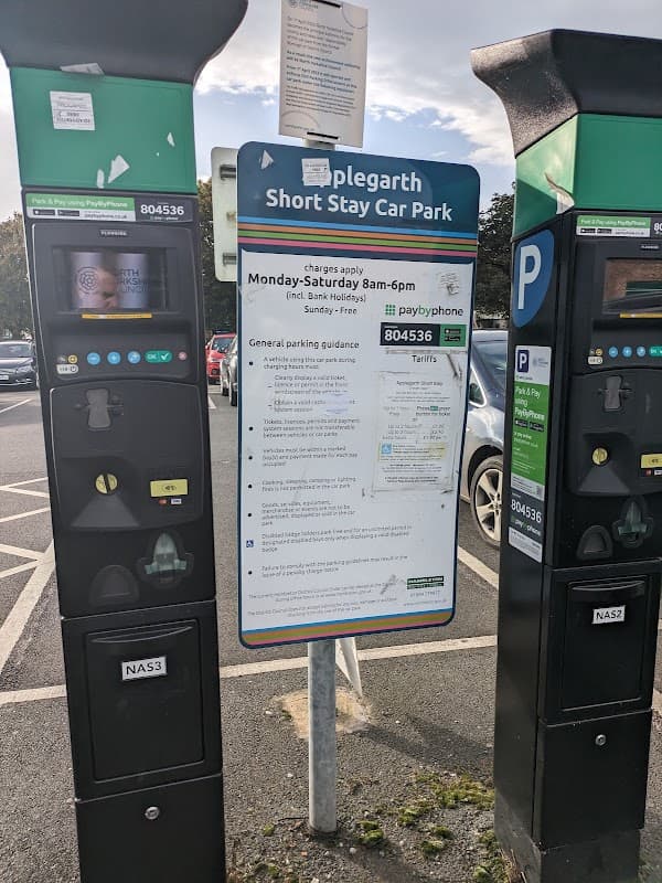Pay & Display parking machines at Applegarth Short Stay Car Park, Northallerton, with parking guidance sign.