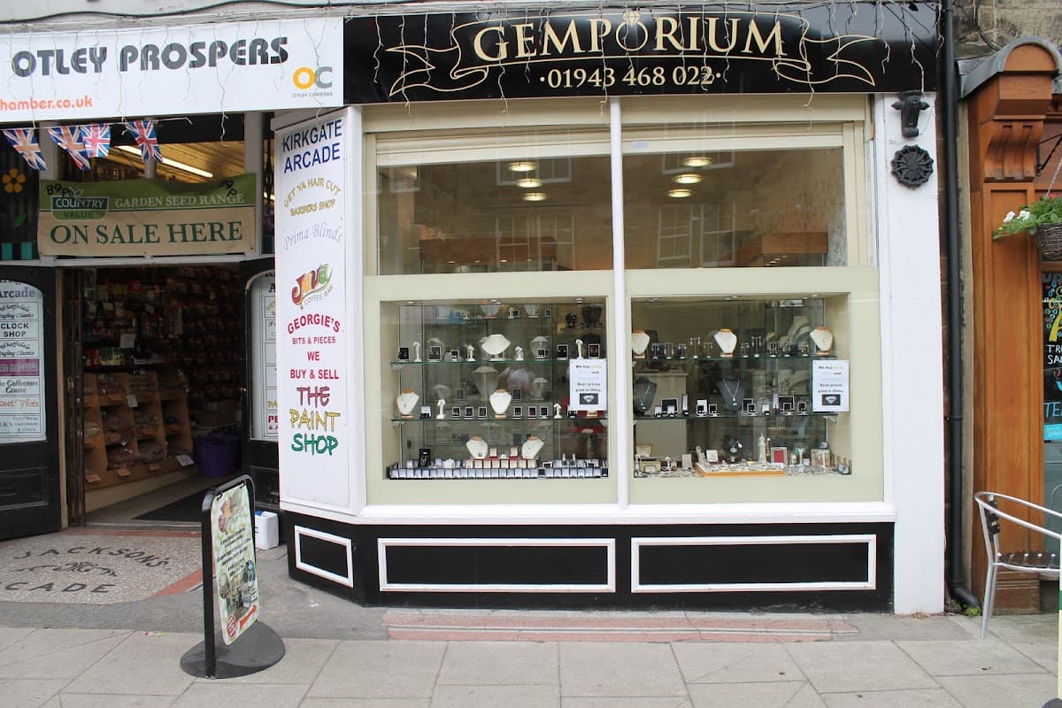 Storefront of Gemporium Jewellers in Otley, featuring display cases with various jewelry pieces and signage.