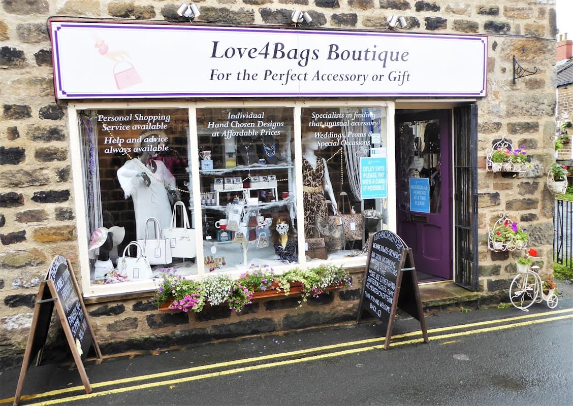 Jewellery boutique storefront with a variety of accessories, flower displays, and chalkboard signs in Otley, Yorkshire.