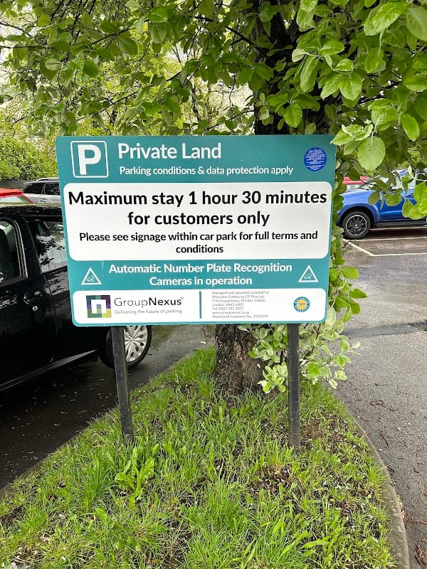 Sign detailing parking rules at Bradfield Road Car Park, including maximum stay and number plate recognition information.