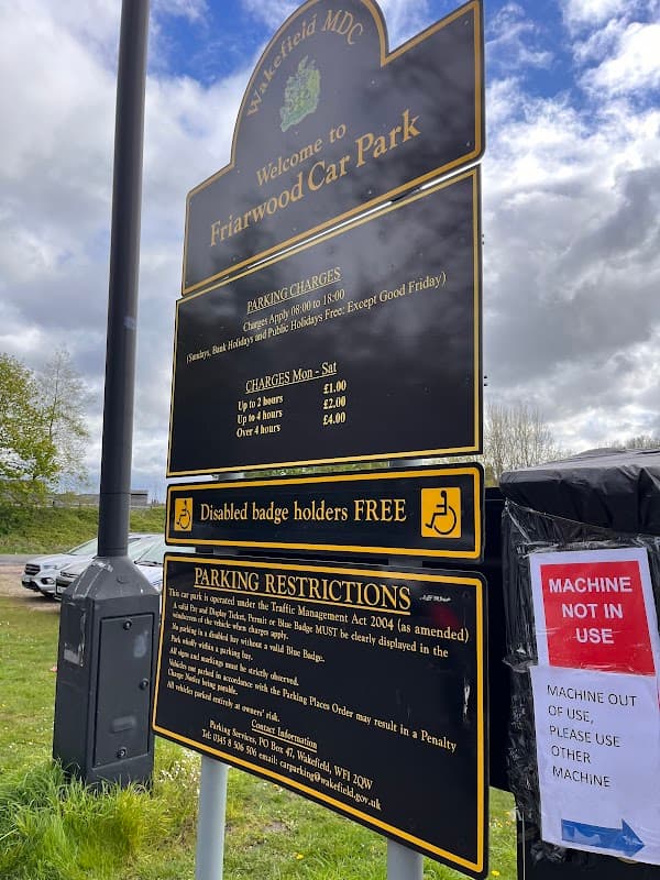 Welcome sign for Friarwood Car Park with parking charges, restrictions, and disabled badge holder information.