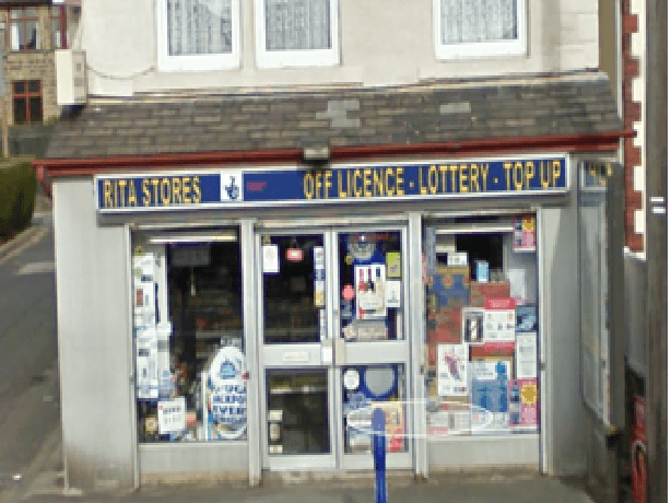 Shiv Stores storefront with signage for off-license, lottery, and top-up services in Riddlesden, Yorkshire.
