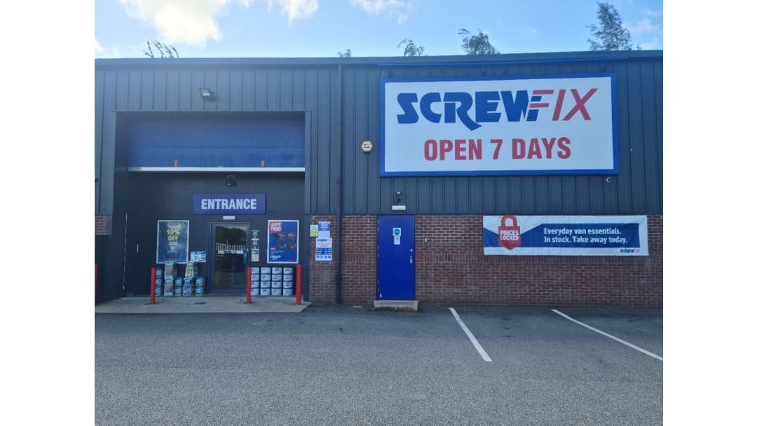 Screwfix store entrance with large signage, open 7 days, and promotional banners outside in Ripon, Yorkshire.