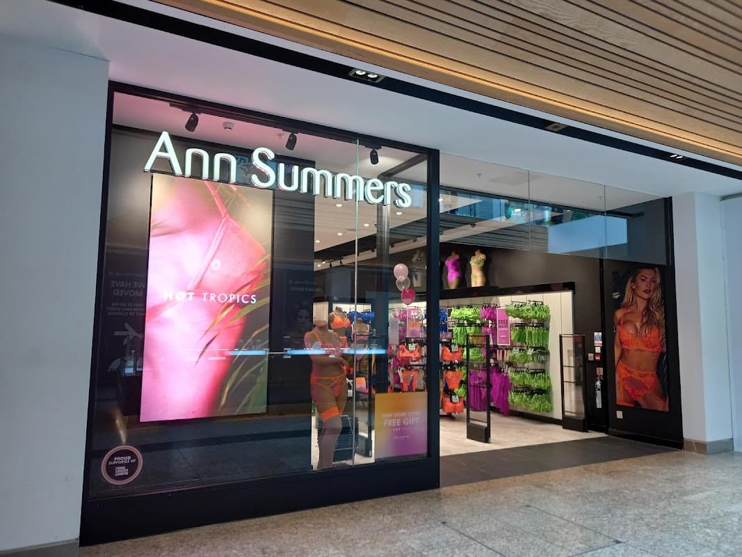 Bright storefront of Ann Summers featuring colorful lingerie displays and promotional signage.