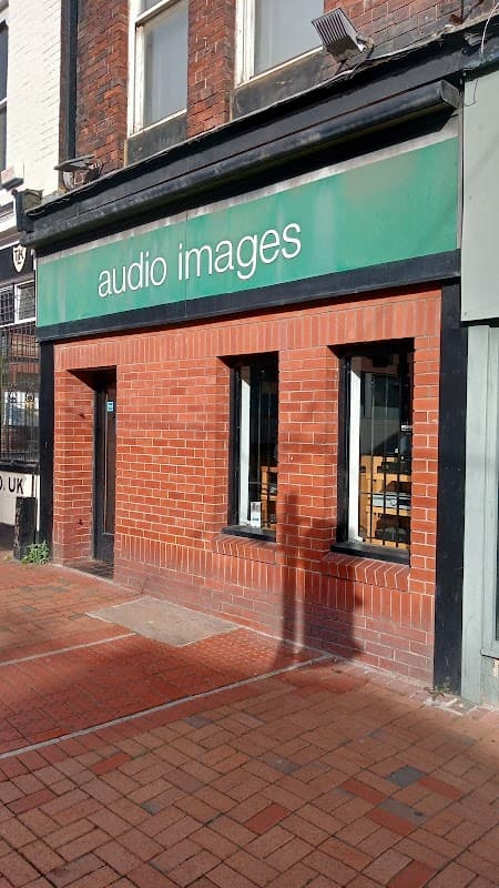 Green storefront with the text "audio images," red brick facade, and two large windows in Sheffield, Yorkshire.