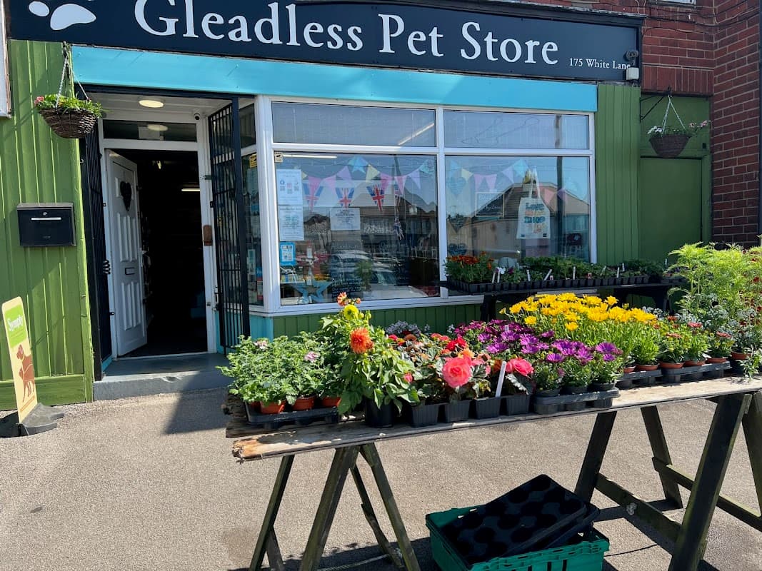 Gleadless Pet Store with colorful flower displays outside and a welcoming entrance in Sheffield, Yorkshire.