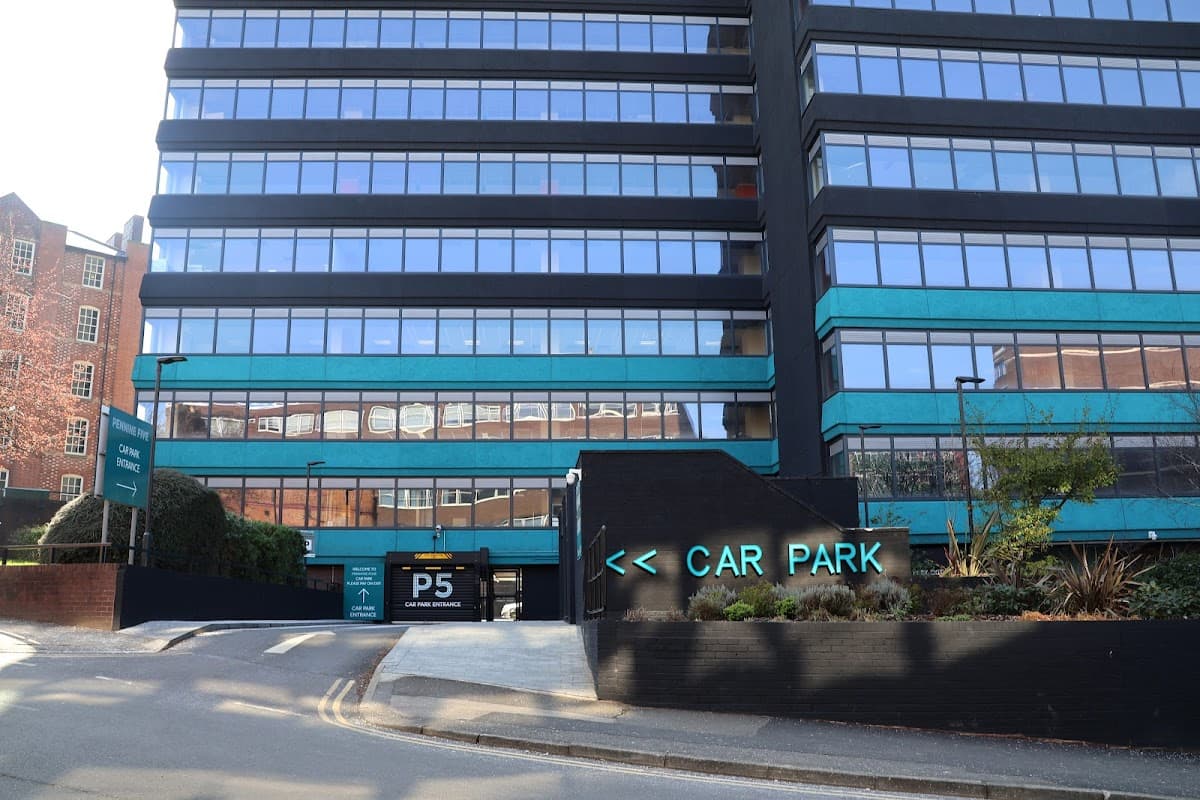 Pay & Display car park entrance with a modern building facade and clear signage in Sheffield, Yorkshire.