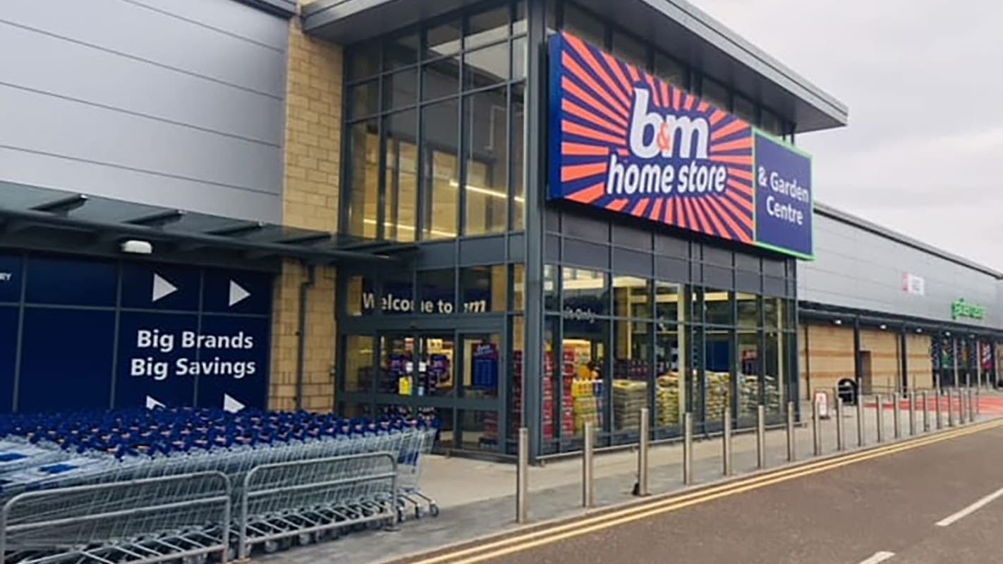B&M Home Store entrance featuring shopping carts and a sign for the Garden Centre, set in Shipley, Yorkshire.