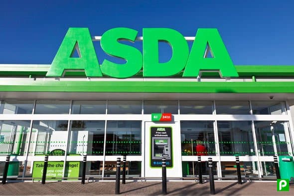Bright green "ASDA" signage above a glass entrance with a cash machine and parking information in Shipley, Yorkshire.