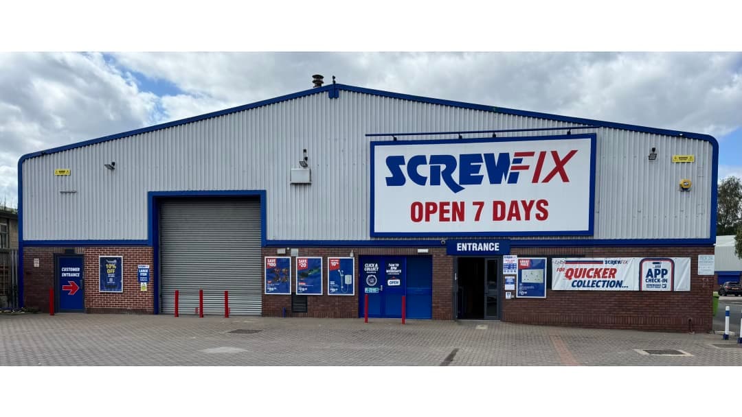 Screwfix store exterior with large signage, entrance, and promotional banners in Wakefield, Yorkshire.