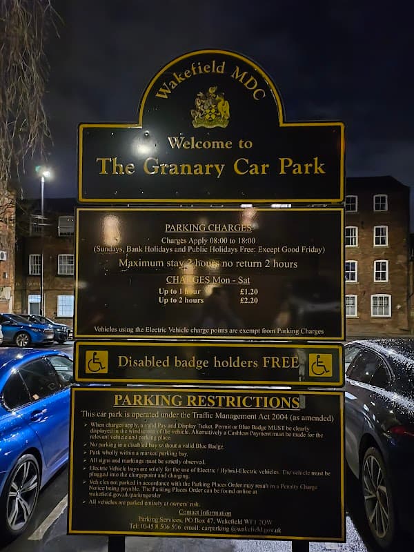 Welcome sign for The Granary Car Park, detailing parking charges, hours, and restrictions in Wakefield, Yorkshire.