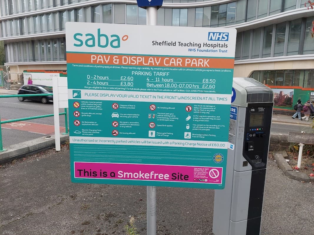 Sign for Saba Pay & Display Car Park at Weston Park Hospital, detailing parking tariffs and regulations.