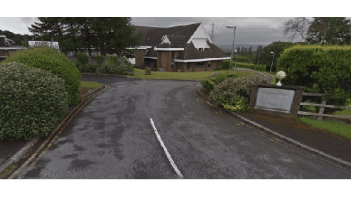 A winding road leads to a modern building surrounded by greenery in West Vale, Yorkshire.