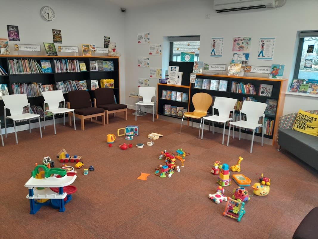 Bright children's area with colorful toys, bookshelves, and seating in Wickersley Library, Yorkshire.
