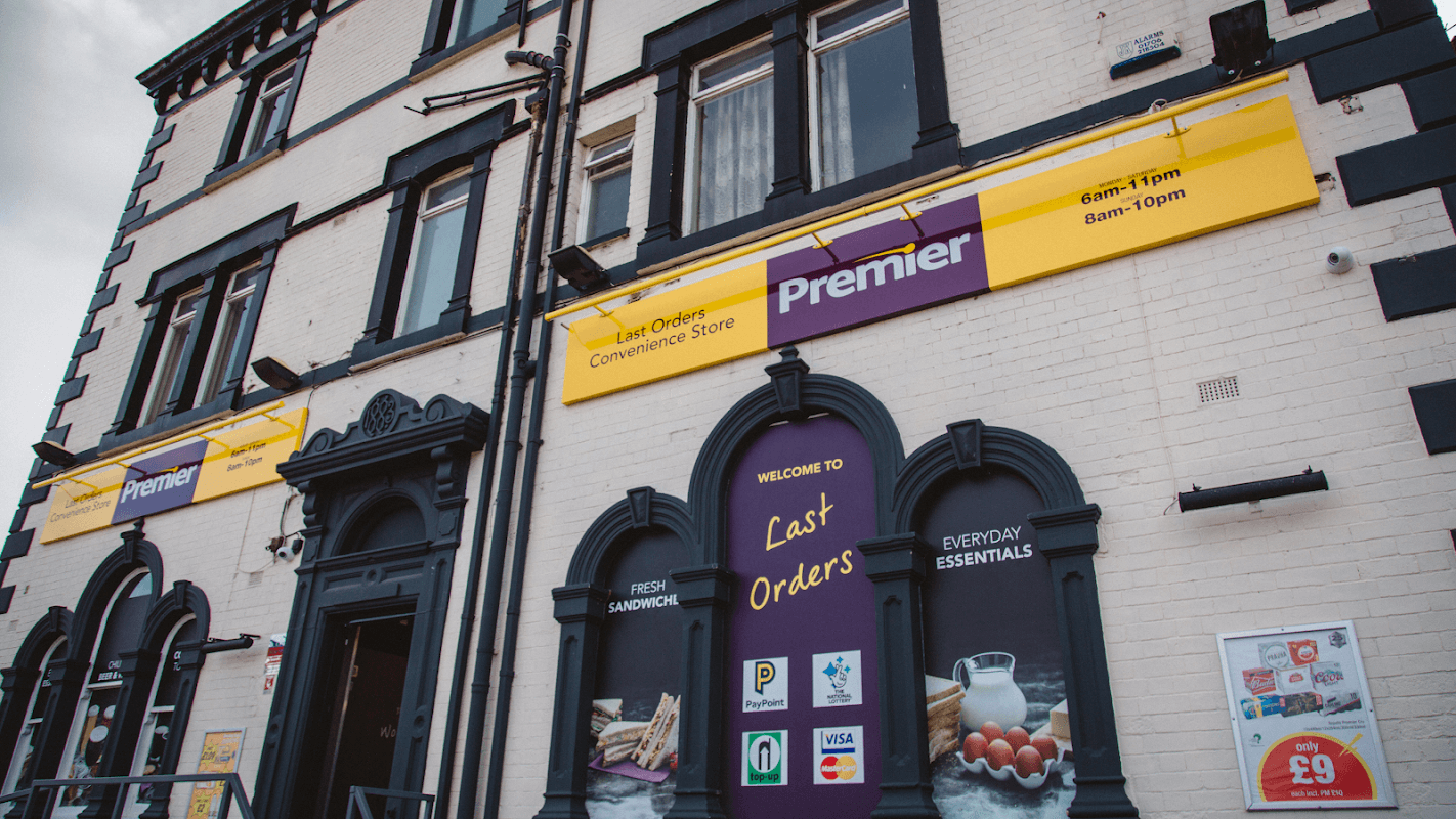 Premier convenience store "Last Orders" in Wombwell, featuring large signage and a welcoming entrance.